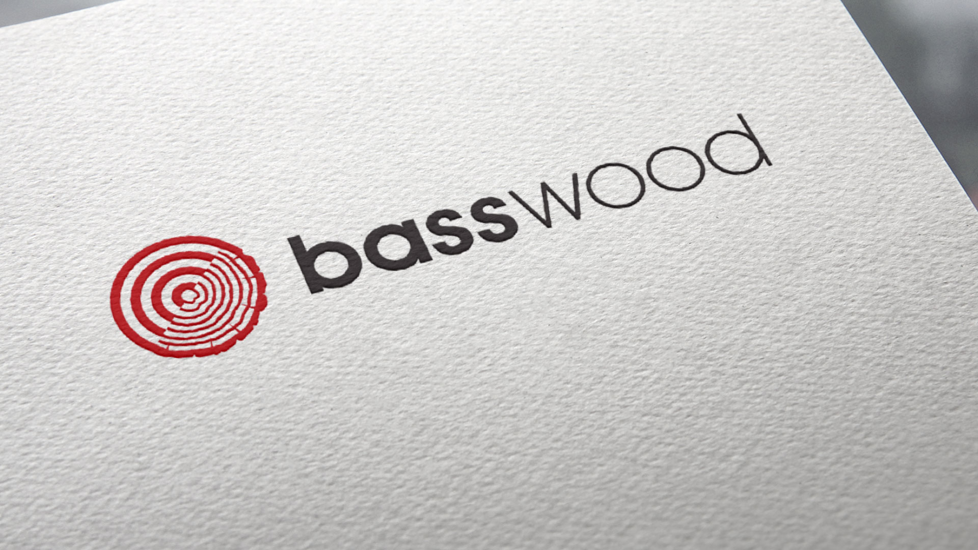 Horizontal wordmark / Identity on textured paper.